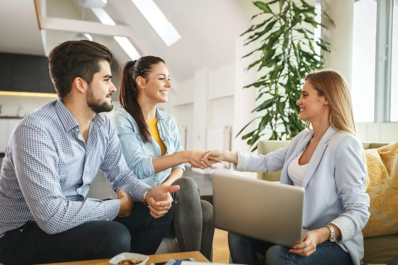 Real estate agent reviewing a property with clients